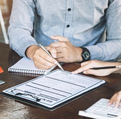 notary reviewing a document with a client