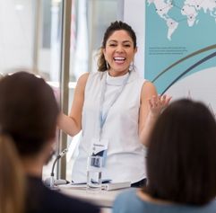 young female nonprofit organization manager presenting to a group