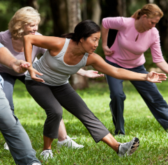 older adults practicing Tai Chi in an outdoor setting