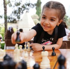 kid playing chess