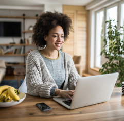 a young woman on her computer in a home