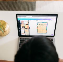 a man using Canva to design a flyer