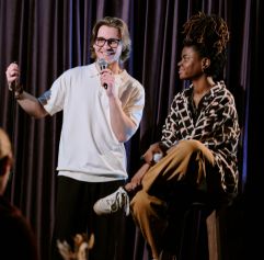 two young adults doing stand up on stage