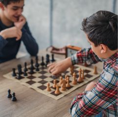 two kids playing chess