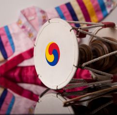 korean drum and traditional outfit in background