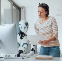 a woman talking to a robot, giving it directions