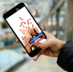 someone holding a cellphone that has social media hearts on it