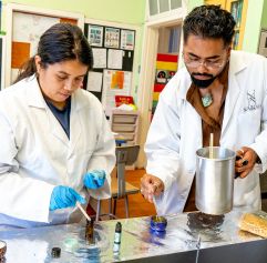 two people making a candle