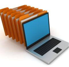a computer with file brown file folders behind it