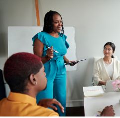 a leader speaking to other employees