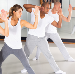 adults practicing a self defense move