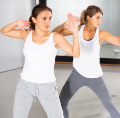 two women in a self defense pose